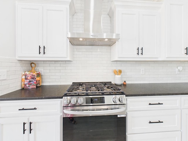 3725 Silver Spur Dr, San Angelo, TX 76904 - kitchen featuring stainless steel gas stove, wall chimney range hood, white cabinets, and backsplash