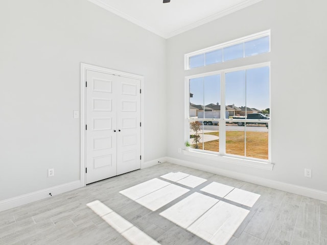 3725 Silver Spur Dr, San Angelo, TX 76904 - unfurnished room featuring crown molding, wood finished floors, and baseboards