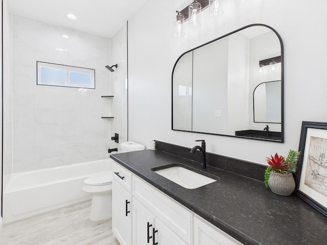 3725 Silver Spur Dr, San Angelo, TX 76904 - bathroom featuring vanity, shower / washtub combination, toilet, wood finished floors, and recessed lighting