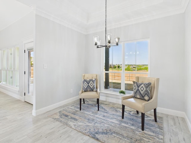 3725 Silver Spur Dr, San Angelo, TX 76904 - living area featuring plenty of natural light, wood finished floors, a chandelier, baseboards, and ornamental molding