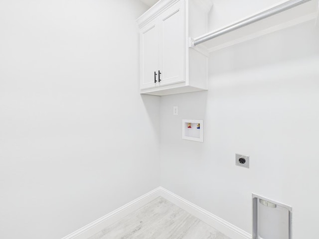 3725 Silver Spur Dr, San Angelo, TX 76904 - laundry room featuring hookup for an electric dryer, cabinet space, washer hookup, baseboards, and light wood finished floors