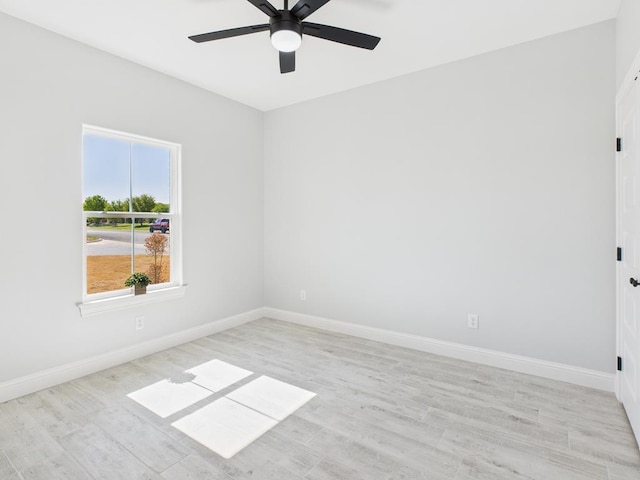 3725 Silver Spur Dr, San Angelo, TX 76904 - unfurnished room with ceiling fan, baseboards, and light wood finished floors