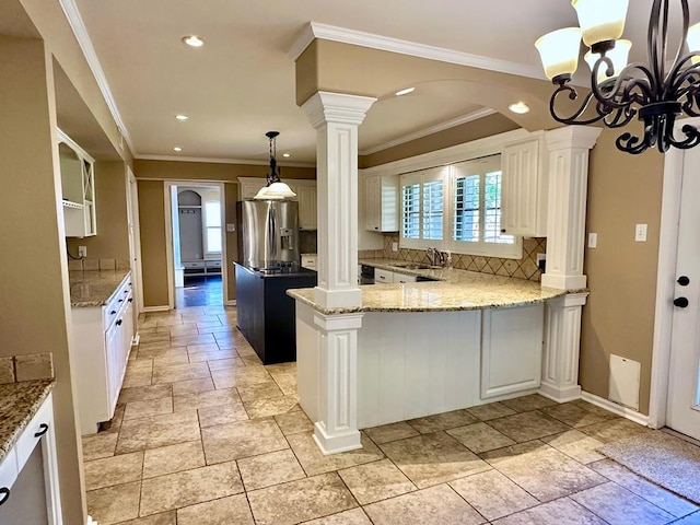5202 Beverly Dr, San Angelo, TX 76904 - kitchen with stainless steel refrigerator with ice dispenser, a sink, decorative backsplash, stone tile floors, and recessed lighting