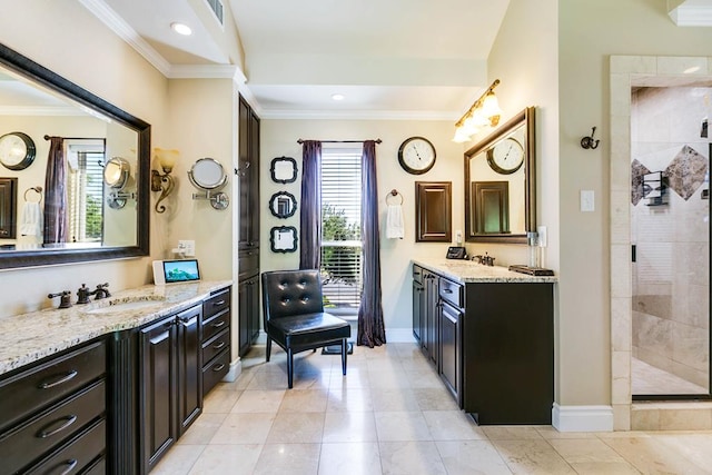 5202 Beverly Dr, San Angelo, TX 76904 - bathroom with crown molding, a stall shower, baseboards, two vanities, and recessed lighting