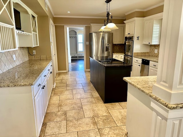 5202 Beverly Dr, San Angelo, TX 76904 - kitchen with stainless steel appliances, stone tile floors, a center island, baseboards, and backsplash