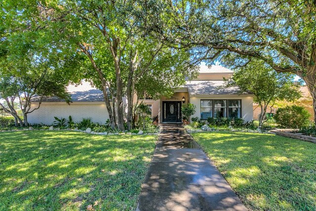 5202 Beverly Dr, San Angelo, TX 76904 - view of front of house featuring a front lawn and brick siding