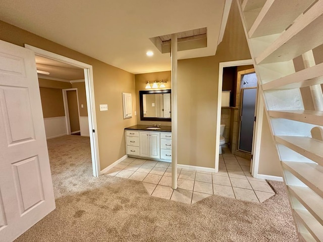 5202 Beverly Dr, San Angelo, TX 76904 - bathroom featuring toilet, vanity, tile patterned floors, and baseboards