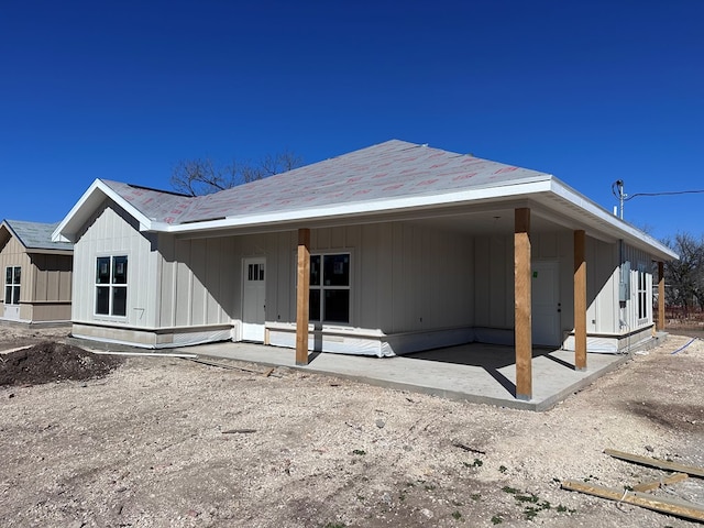 back of property with a patio area