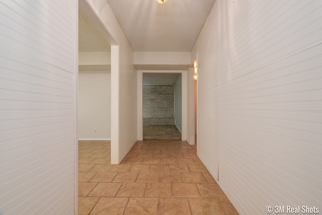 3317 Rockbrook Dr, San Angelo, TX 76904 - hallway with light stone finish floors