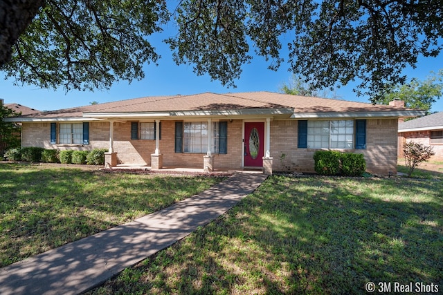 3317 Rockbrook Dr, San Angelo, TX 76904 - ranch-style home with a front yard and brick siding
