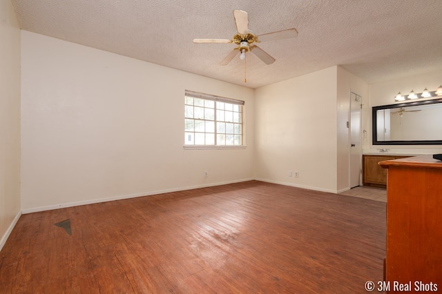 3317 Rockbrook Dr, San Angelo, TX 76904 - unfurnished room with light wood-type flooring, a ceiling fan, and a textured ceiling