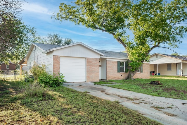 2007 Stanton St, Brady, TX 76825 - ranch-style house with brick siding, concrete driveway, and an attached garage