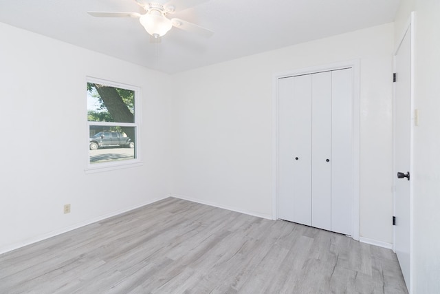 2007 Stanton St, Brady, TX 76825 - unfurnished bedroom featuring light wood-type flooring, a closet, baseboards, and ceiling fan
