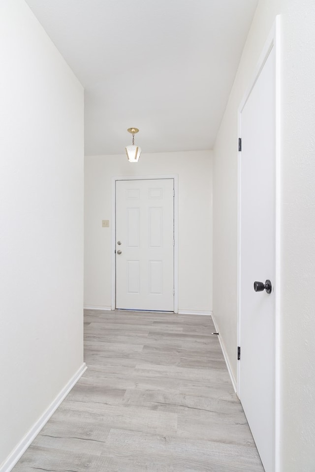 2007 Stanton St, Brady, TX 76825 - corridor with light wood-style floors and baseboards