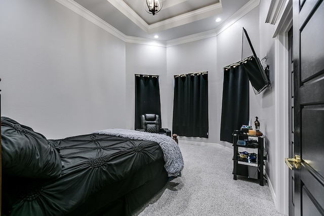 bedroom featuring crown molding, carpet flooring, and a tray ceiling