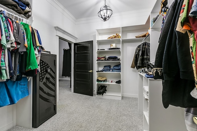 spacious closet with light carpet and an inviting chandelier