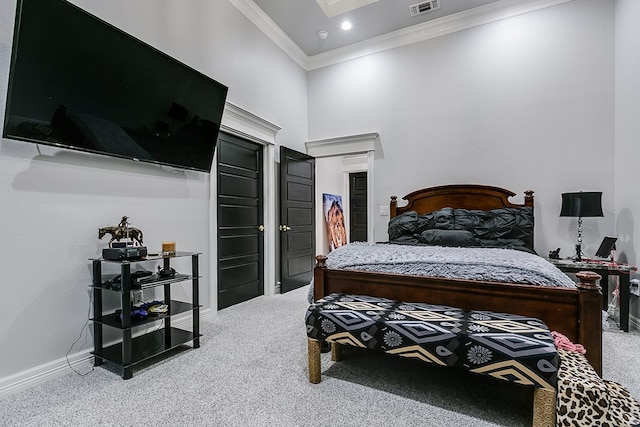 bedroom featuring crown molding and carpet flooring