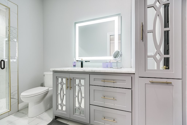 bathroom with walk in shower, vanity, and toilet