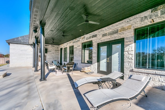 view of patio / terrace featuring ceiling fan and french doors