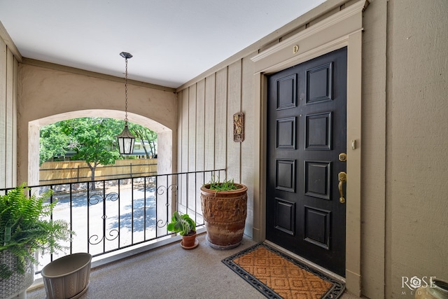entrance to property featuring a balcony