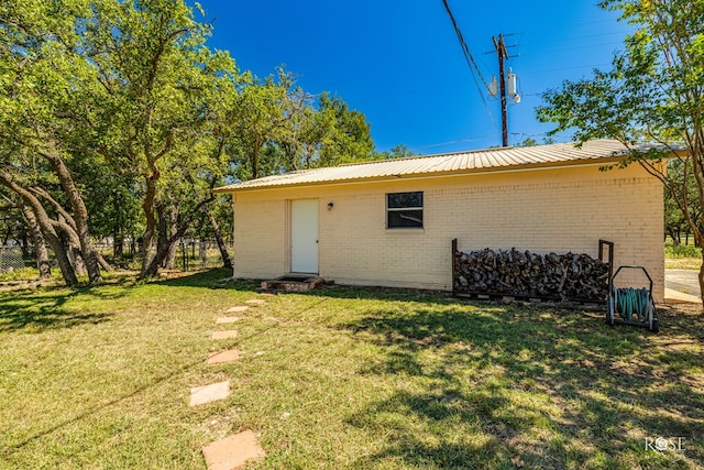 back of house with a yard