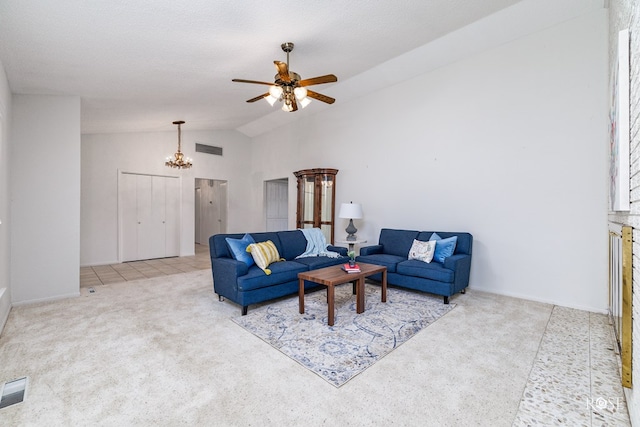 carpeted living room with ceiling fan with notable chandelier, vaulted ceiling, and a textured ceiling