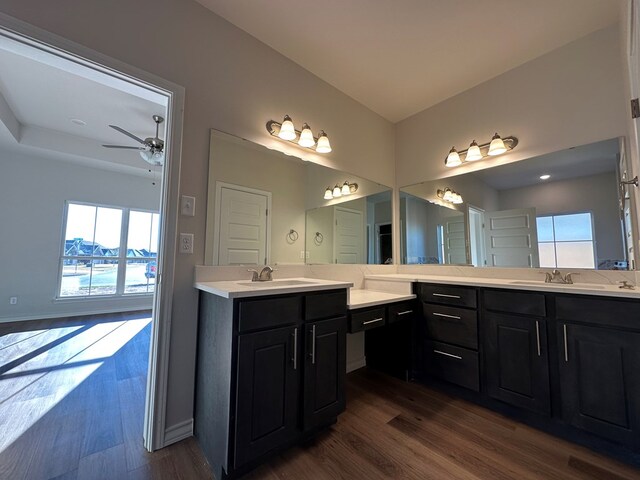 bathroom featuring vanity, hardwood / wood-style flooring, and ceiling fan