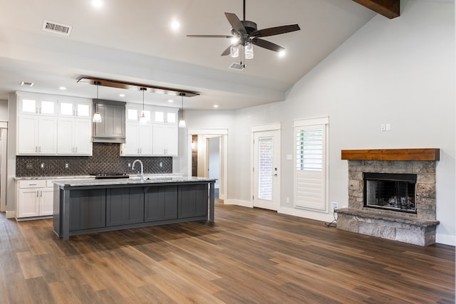 1906 Colonial Dr, San Angelo, TX 76904 - kitchen with open floor plan, white cabinetry, dark wood-style flooring, glass insert cabinets, and recessed lighting