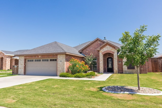 1906 Colonial Dr, San Angelo, TX 76904 - view of front of property with brick siding, an attached garage, a front yard, and concrete driveway