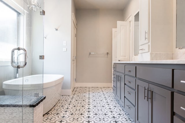 1906 Colonial Dr, San Angelo, TX 76904 - full bathroom featuring vanity, a freestanding bath, and a shower stall