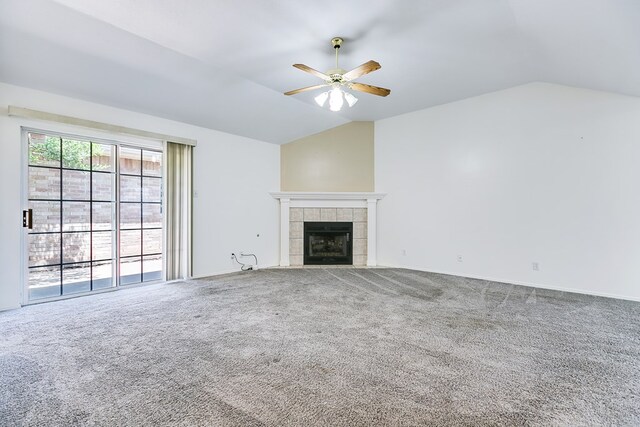 unfurnished living room featuring carpet flooring, ceiling fan, and vaulted ceiling