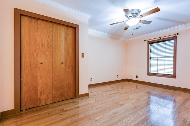 6626 Knickerbocker Rd, San Angelo, TX 76904 - unfurnished bedroom with visible vents, light wood-type flooring, baseboards, a closet, and ornamental molding