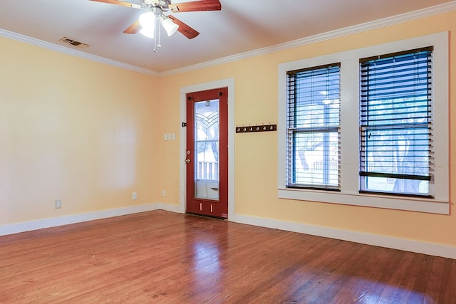 6626 Knickerbocker Rd, San Angelo, TX 76904 - interior space with crown molding, visible vents, a healthy amount of sunlight, and wood finished floors