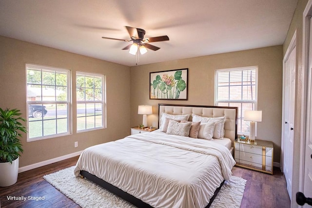 1521 S Jackson St, San Angelo, TX 76904 - bedroom featuring multiple windows, baseboards, and wood finished floors