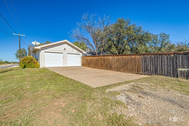 garage featuring a lawn