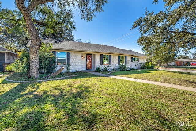 ranch-style home with a front lawn