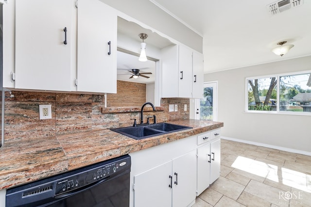 kitchen featuring tasteful backsplash, white cabinetry, black dishwasher, sink, and ceiling fan