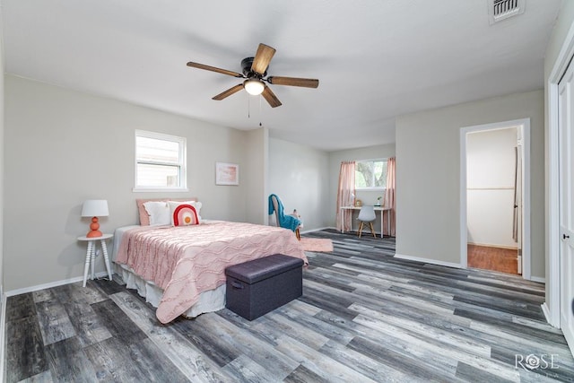 3119 Woodland Cir, San Angelo, TX 76904 - bedroom featuring baseboards, wood finished floors, and visible vents