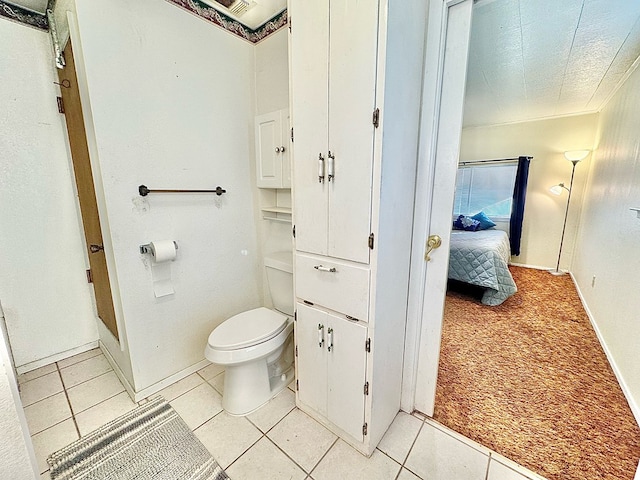 bathroom featuring tile patterned floors and toilet