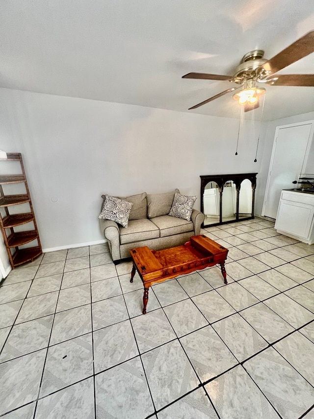 tiled living room with ceiling fan