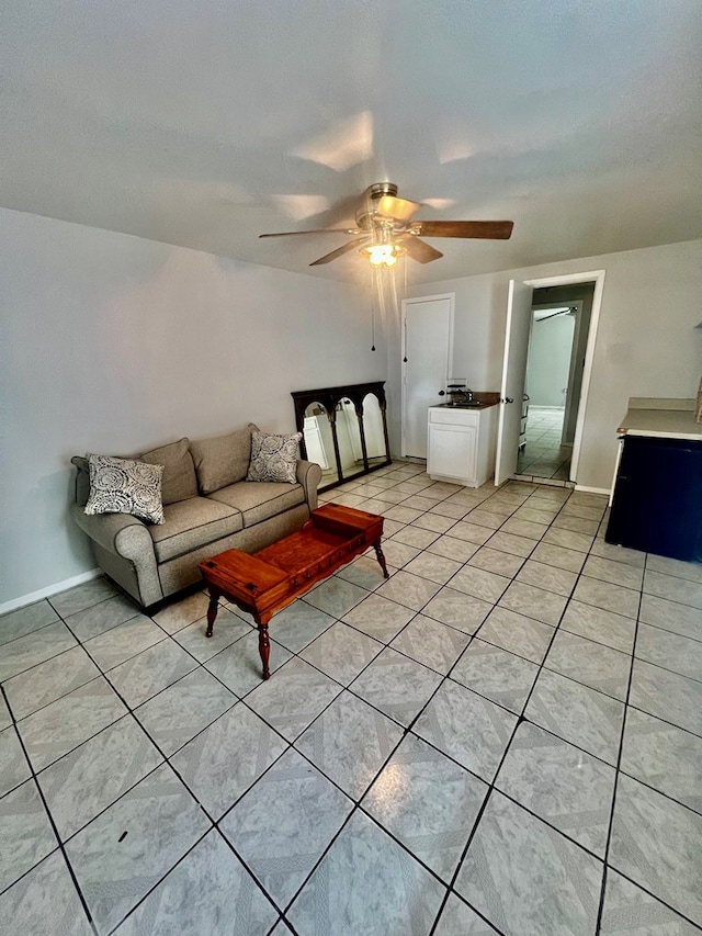 living room featuring light tile patterned flooring and ceiling fan