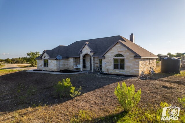 view of french country inspired facade