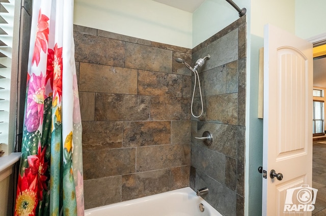 bathroom with shower / tub combo with curtain