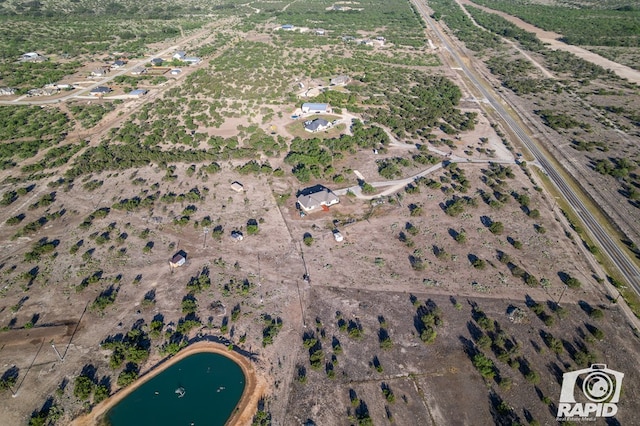 bird's eye view featuring a water view and a rural view