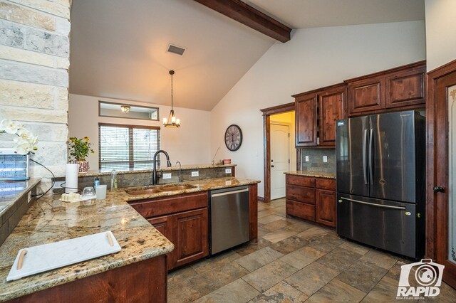 kitchen with sink, stainless steel appliances, light stone counters, decorative light fixtures, and beamed ceiling