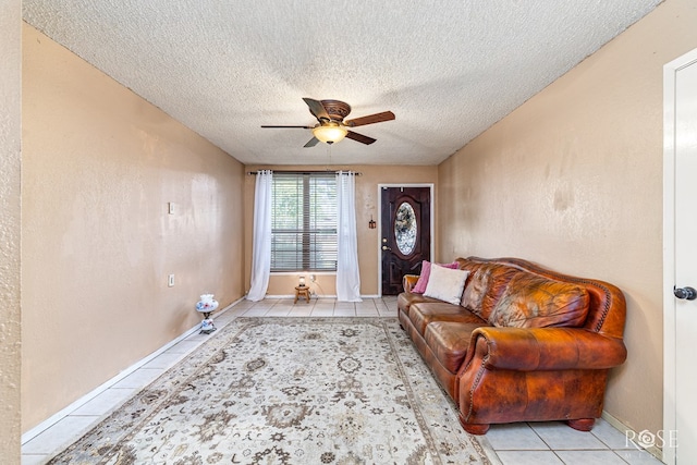 1103 E 43rd St, San Angelo, TX 76903 - living area with tile patterned flooring, a ceiling fan, and a textured ceiling