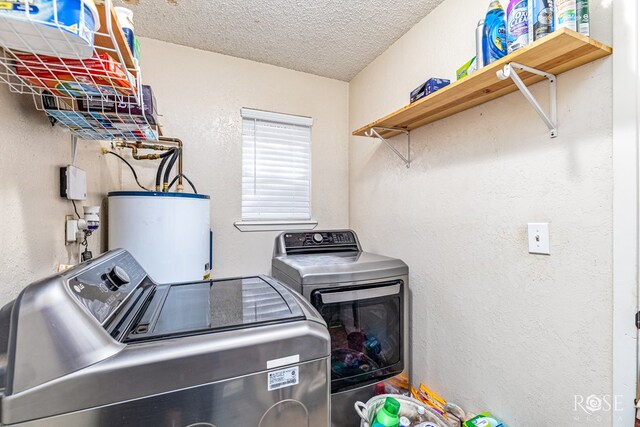 1103 E 43rd St, San Angelo, TX 76903 - laundry room with water heater, washer and clothes dryer, a textured ceiling, and a textured wall