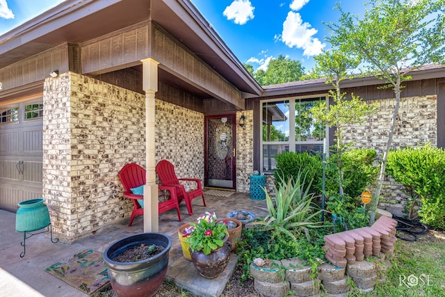 1103 E 43rd St, San Angelo, TX 76903 - doorway to property with brick siding and a patio