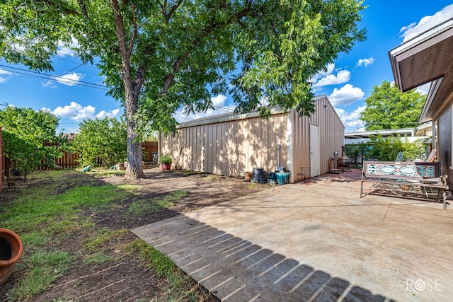 1103 E 43rd St, San Angelo, TX 76903 - fenced backyard featuring a patio area and an outbuilding
