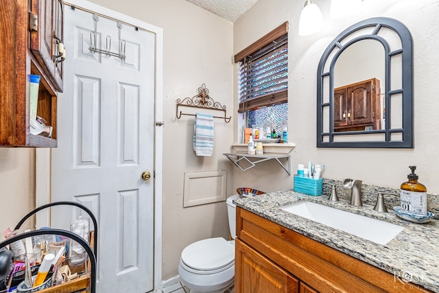 1103 E 43rd St, San Angelo, TX 76903 - bathroom featuring vanity and a textured ceiling